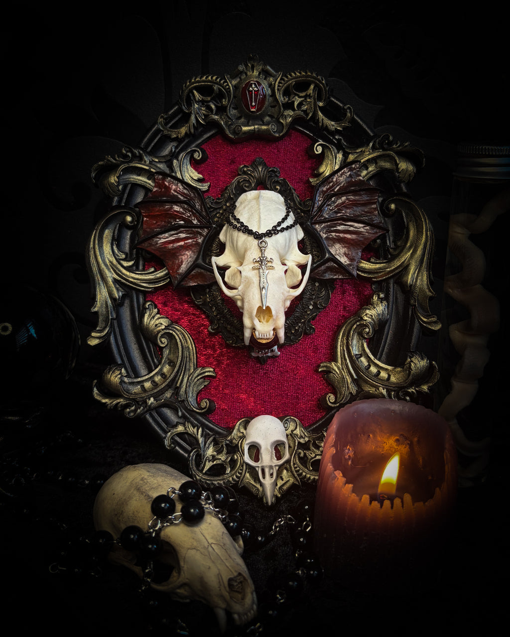 Handmade gothic wall decor with real mink skull, hand-cast bat wings, red velvet and gold frame — Malachar by Morbid Oddities