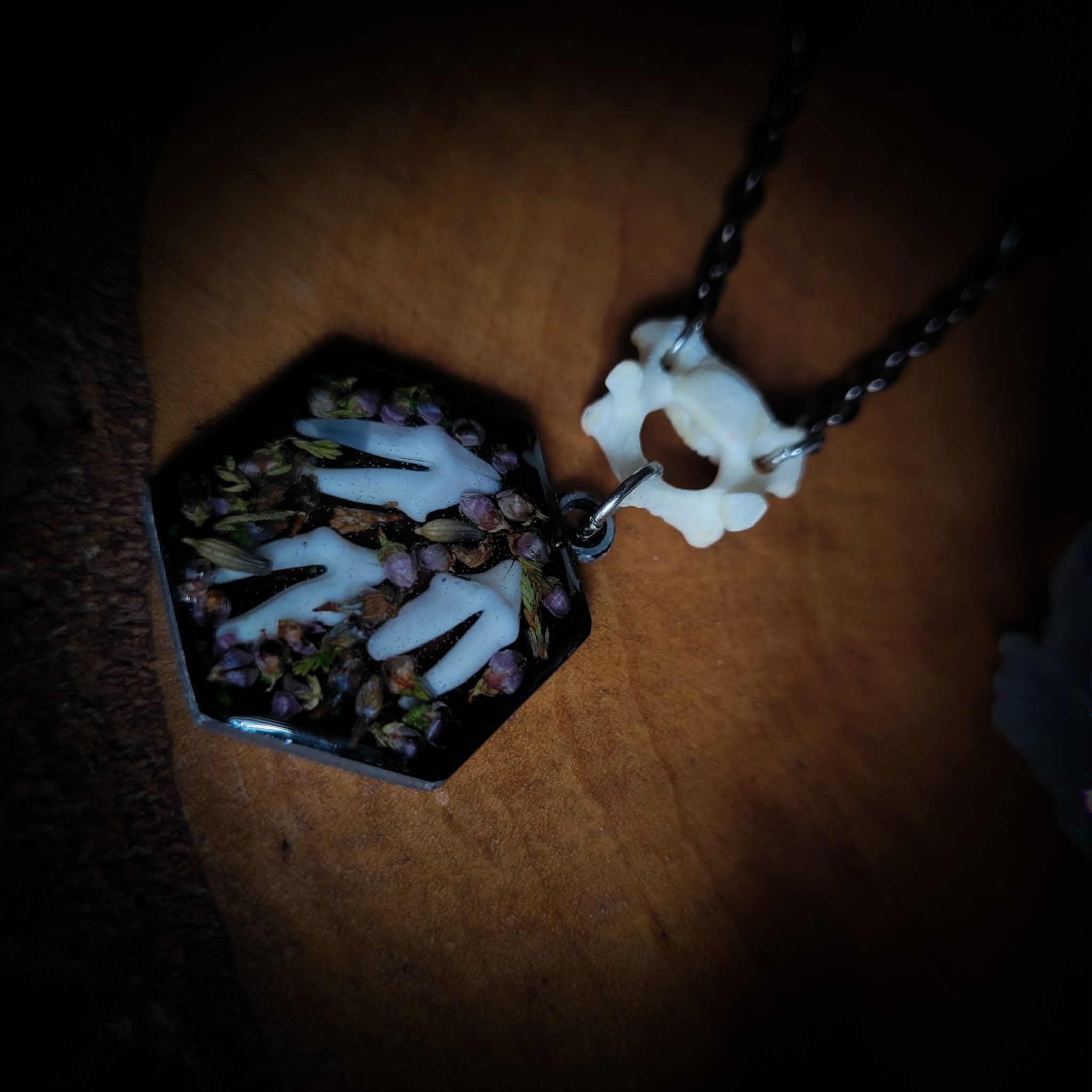 Handmade gothic necklace — real fox teeth and dried heather flowers in hexagonal resin pendant, vertebrae connector, metal bat charm