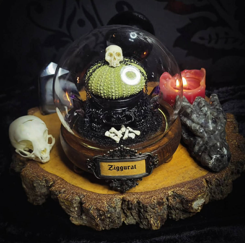 Siggurat | Occult — handmade gothic altar piece with ziggurat-inspired centerpiece, real bone elements, sea urchin skeleton, decorative crystals and chains under glass dome on hand-painted wooden base, 10x10cm
