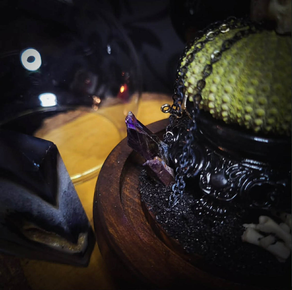 Siggurat | Occult — handmade gothic altar piece with ziggurat-inspired centerpiece, real bone elements, sea urchin skeleton, decorative crystals and chains under glass dome on hand-painted wooden base, 10x10cm
